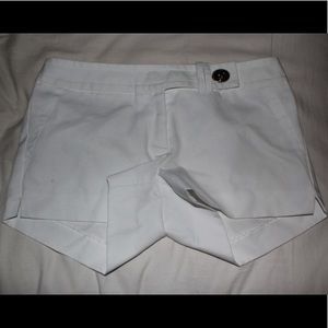 White shorts with turn lock detail